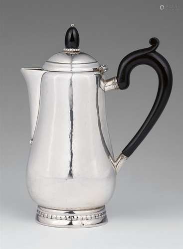 A silver mocha pot by Georg Jensen, model no. 41Pear-form corpus with a short spout, the ebonised