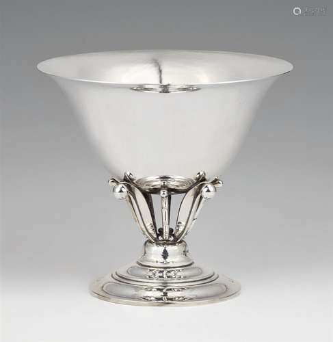 A silver tazza by Georg Jensen, model no. 17The short stem decorated with stylised berries and