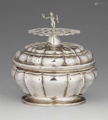 A Nuremberg silver sugar box with spoon holderRounded oval box with fluting, corresponding lid,