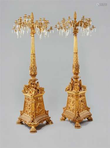 A pair of large carved wood candelabraCarved and gilded wood with ormolu mountings and cut glass