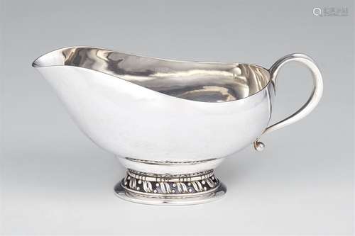 A small silver sauce boat by Georg Jensen, model no. 435Oval sauce boat on a base with pierced