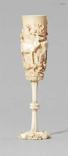 A carved ivory goblet with deerWorked from four pieces and screw-mounted. A flaring goblet carved