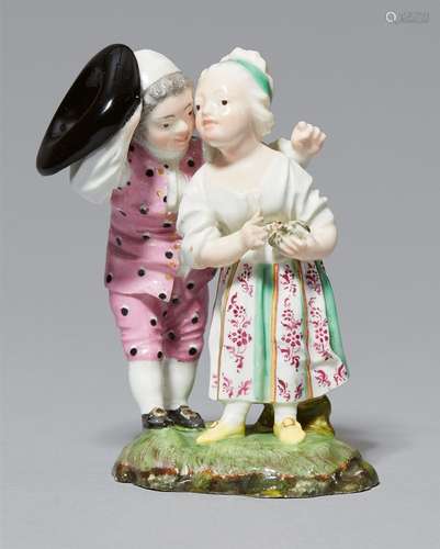 A Höchst porcelain model of children with a bird's nestTwo-figure group on an earth mound base. Blue