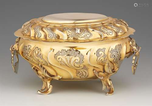 A large Copenhagen silver sugar boxParcel gilt oval silver box on four curved supports. Decorated