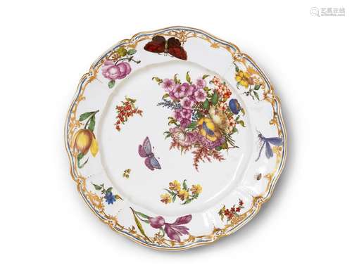 A Nymphenburg porcelain plate related to the court serviceScalloped plate with a thick, moulded rim.