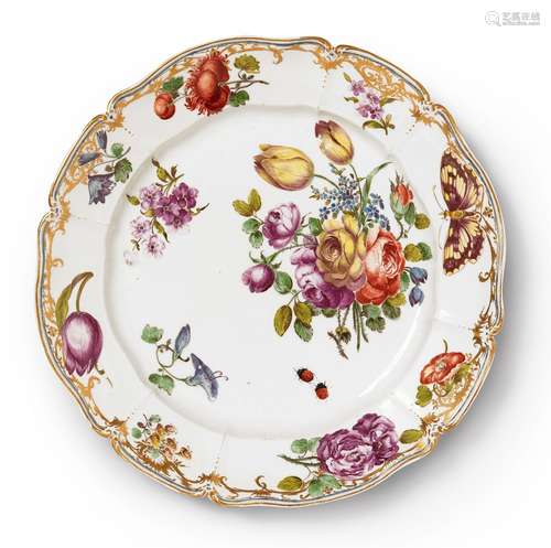 A Nymphenburg porcelain plate related to the court serviceScalloped plate with a thick, moulded rim.