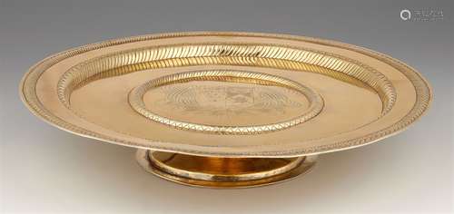 A Charles II silver tazzaRound silver-gilt presentation platter on a waisted foot, the flaring rim