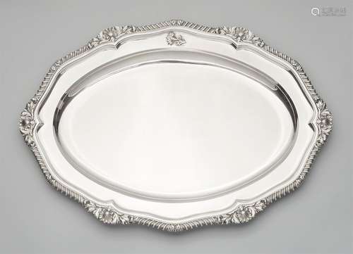 A large George III silver platterA large scalloped oval platter, the gadrooned rim with a