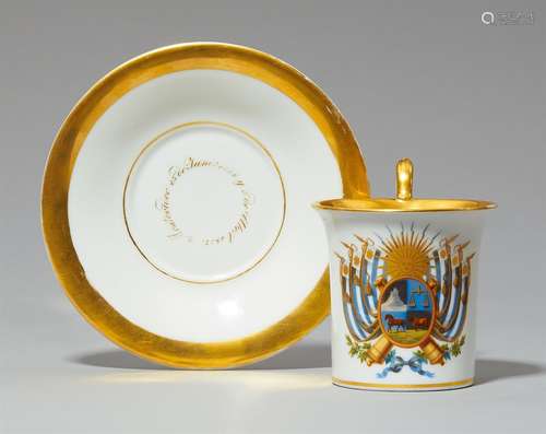 A rare porcelain cup and saucer inscribed MontevideoThe display side decorated with the opulent coat