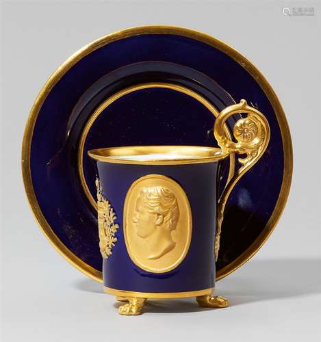 A Meissen porcelain cup with portraits of Friedrich August II of Saxony and Maria Anna of