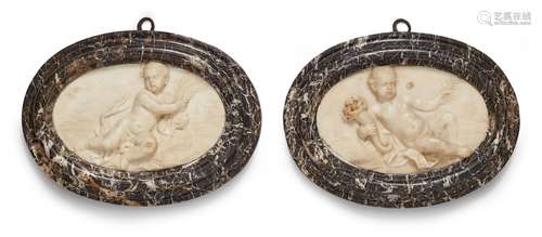 A pair of relief plaques with allegories of spring and summerWhite Carrara marble oval plaques in