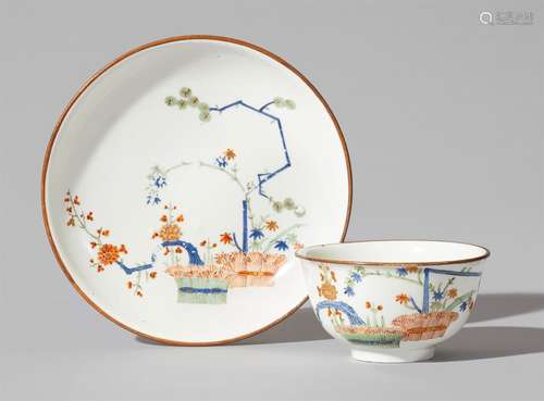 An early Meissen porcelain tea bowl and saucer with a palace inventory numberExceedingly thinly