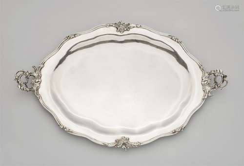 A large Augsburg silver platterA moulded silver platter with rocaille handles, the narrow rim with