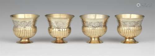 Four Augsburg silver beakersSilver; partly gilded. Parcel-gilt silver beakers with moulded rims