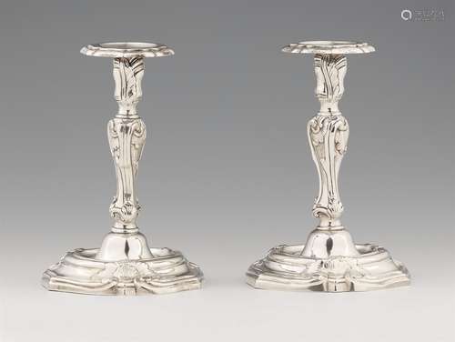 A pair of Italian silver candlesticksBaluster-form shafts with shellwork decor issuing from round