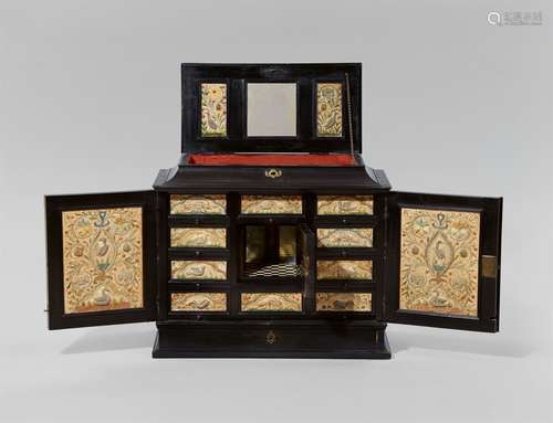 A Flemish inlaid cabinet with embroidered decorEbony and ivory on softwood corpus with embroidered