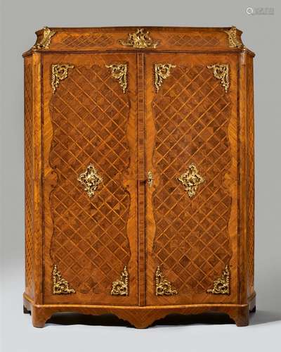 A Louis XV inlaid cabinetInlaid with palisander, rosewood, and boxwood on oak and softwood corpus,