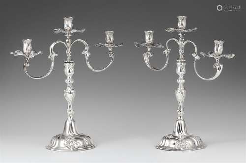 A pair of Braunschweig silver candelabraSilver. Baluster-form shafts with shellwork décor and