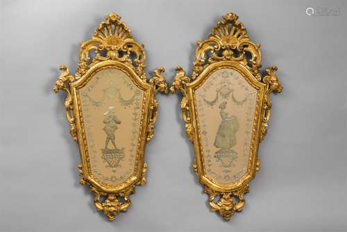 A pair of Venetian giltwood mirrorsTrapezoid form with curved upper border decorated with rocaille