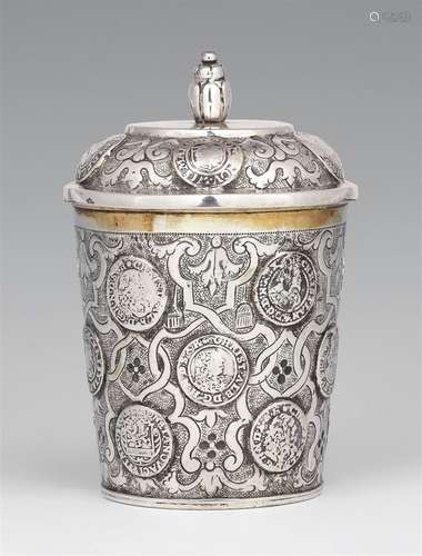 A Braunschweig silver coin beakerSilver; gilded inside. Silver beaker with gilt interior, with