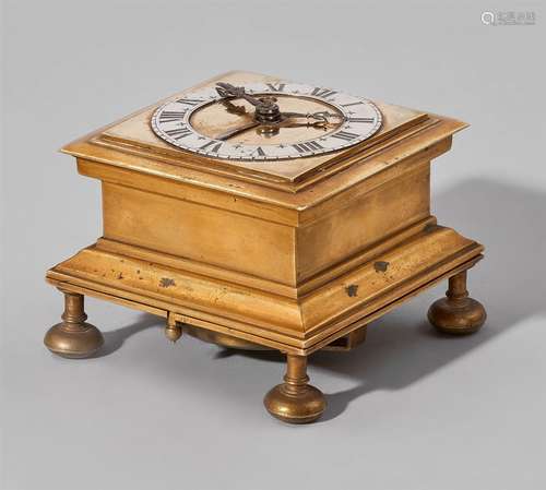 A small rare Bremen table clockGilt brass clock with silver dial, black Roman numerals and blued