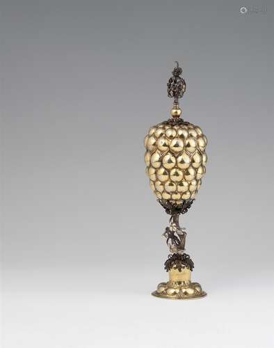 A Nuremberg silver gilt grape gobletSilver; gold-plated. Eight-lobed base supporting a figural shaft