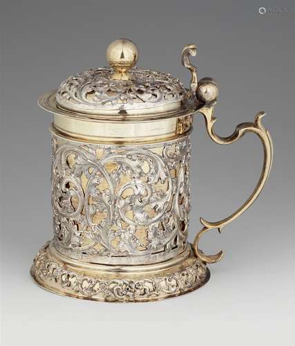 A Baroque silver tankardSilver; partly gilded. Parcel-gilt silver tankard, cylindrical corpus