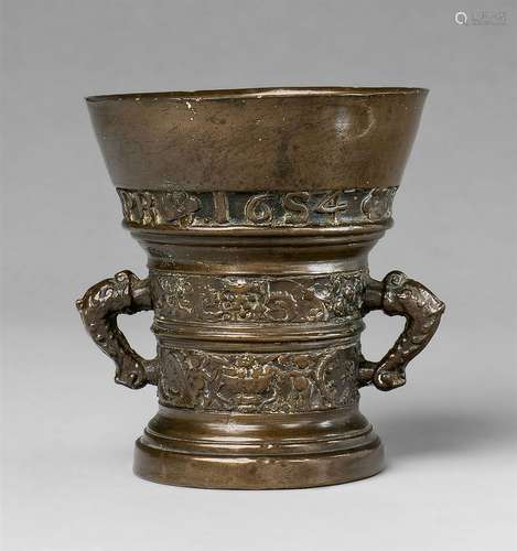 A Netherlandish mortar with dolphin handlesGolden brown cast bronze with finely worn patina. Of