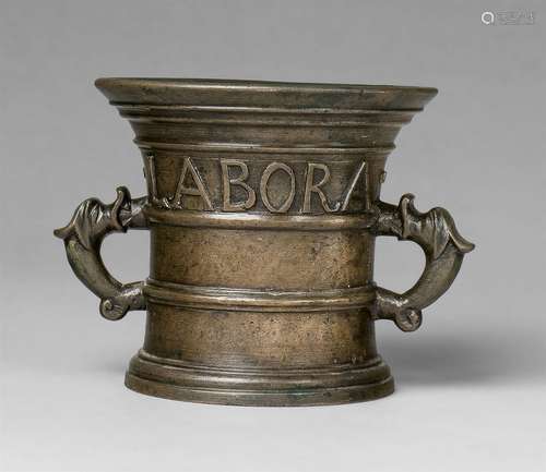 A mortar inscribed “Ora et Labora”Cast bronze with shimmering silvery patina. Of cylindrical form