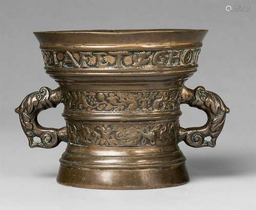 A small mortar with a religious inscriptionCast bronze with golden brown patina. Decorated with