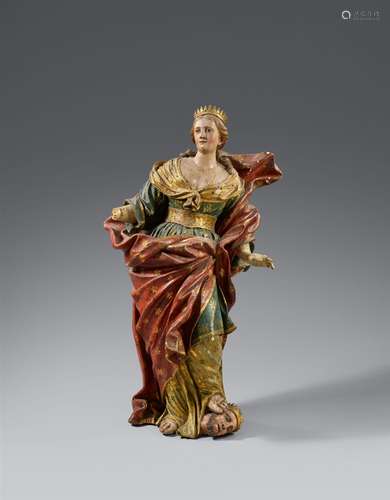 An 18th century carved wood figure of Catherine of Alexandria, presumably SpanishCarved in the