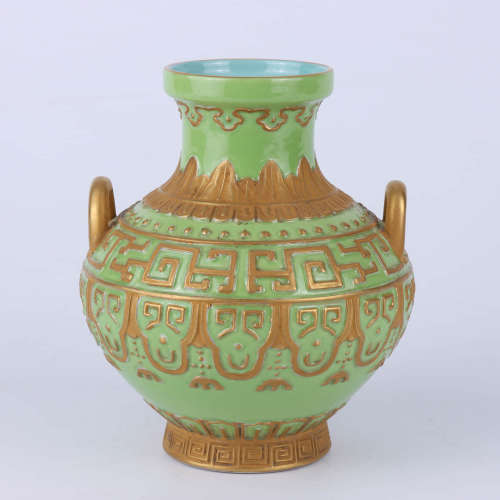 A Chinese green ground glazed gilt decorated double handled porcelain vase