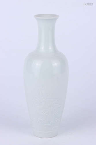 A white glazed incised porcelain bottle vase