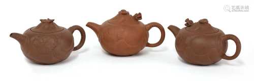 A collection of three Yixing zisha teapots,