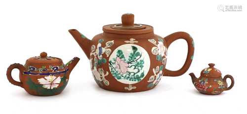 A collection of three Chinese Yixing zisha teapots,