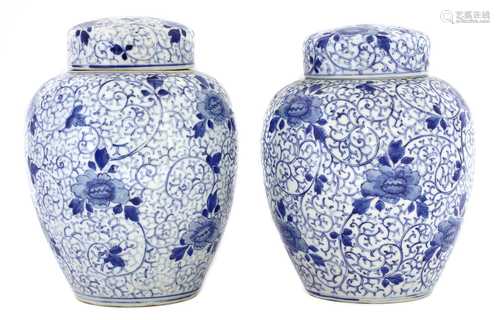 A pair of Japanese blue and white jars and covers,