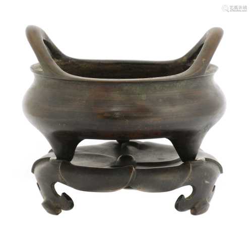 A Chinese bronze incense burner and stand,