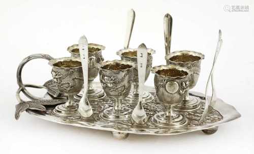 A Chinese silver six-piece egg cruet,