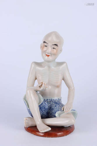 A Chinese porcelain figural statue