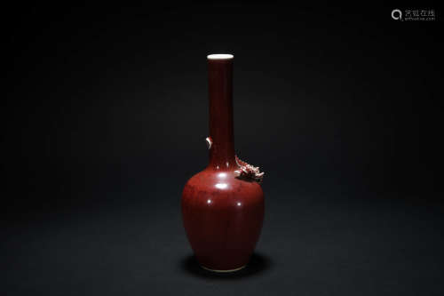 A Chinese shiny red glaze vase with dragon pattern