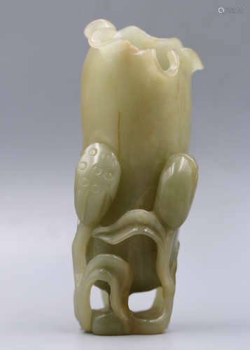 A chinese celadon jade lotus vase