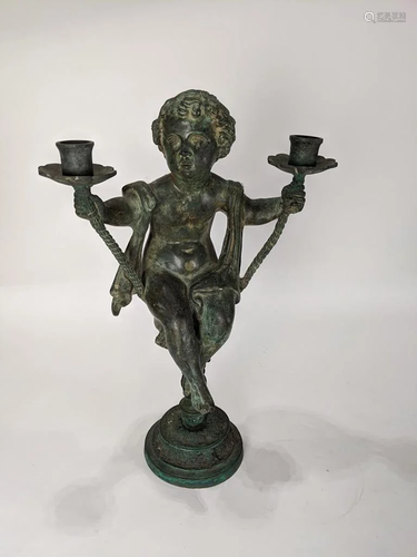 A Patinated metal candelabra in the Renaiss…