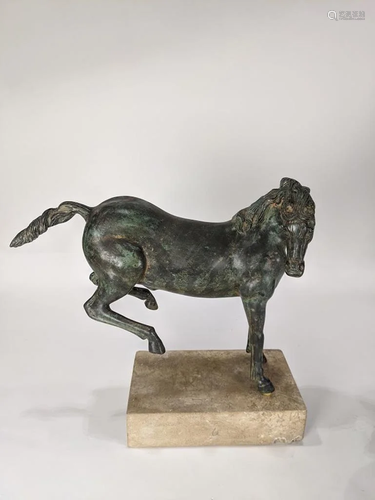 Patinated metal sculpture of a bucking ho…