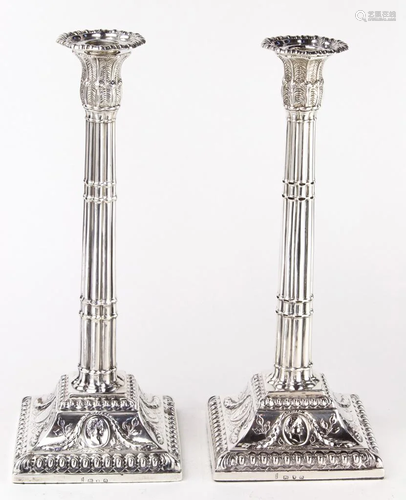 A pair of George III sterling weighted candles…