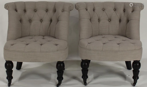 A pair of Moderne tufted slipper chairs