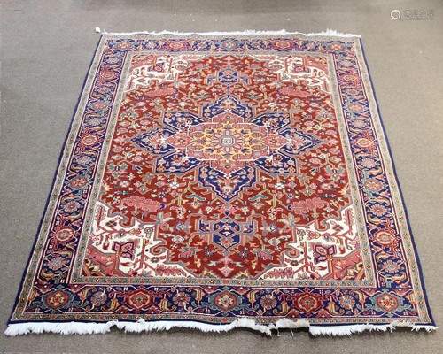 A Persian Heriz carpet