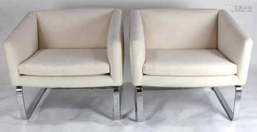 A pair of Selig cantilevered lounge chair…