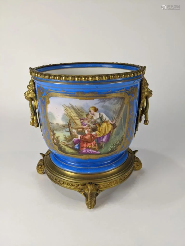 A French Sevres style gilt and blue wine cooler