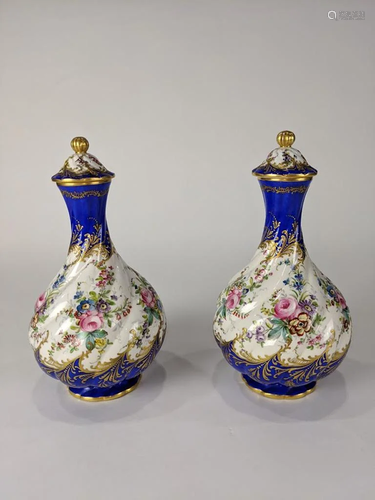 A Pair of Continental porcelain lidded vases