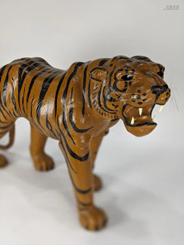 Papier mache figure of a walking tiger